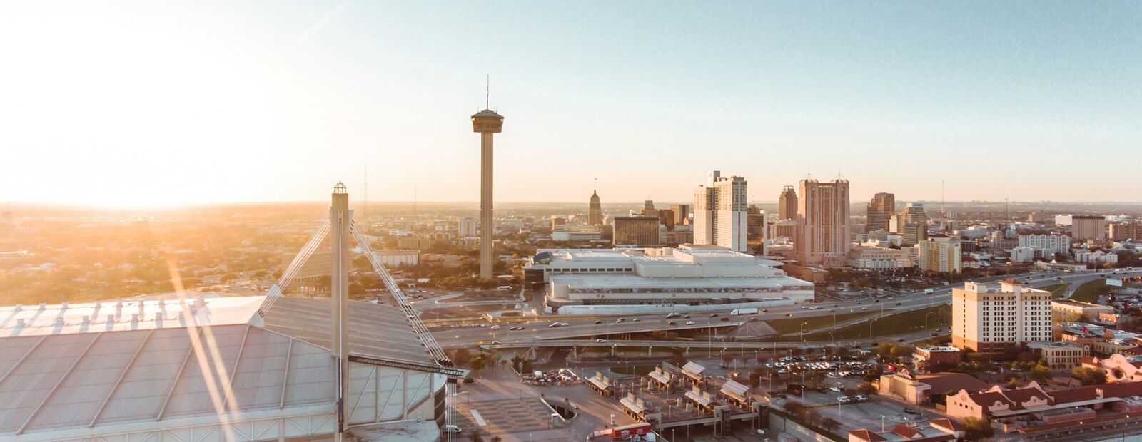 Aerial view of the Alamodome and downtown San Antonio at sunrise
