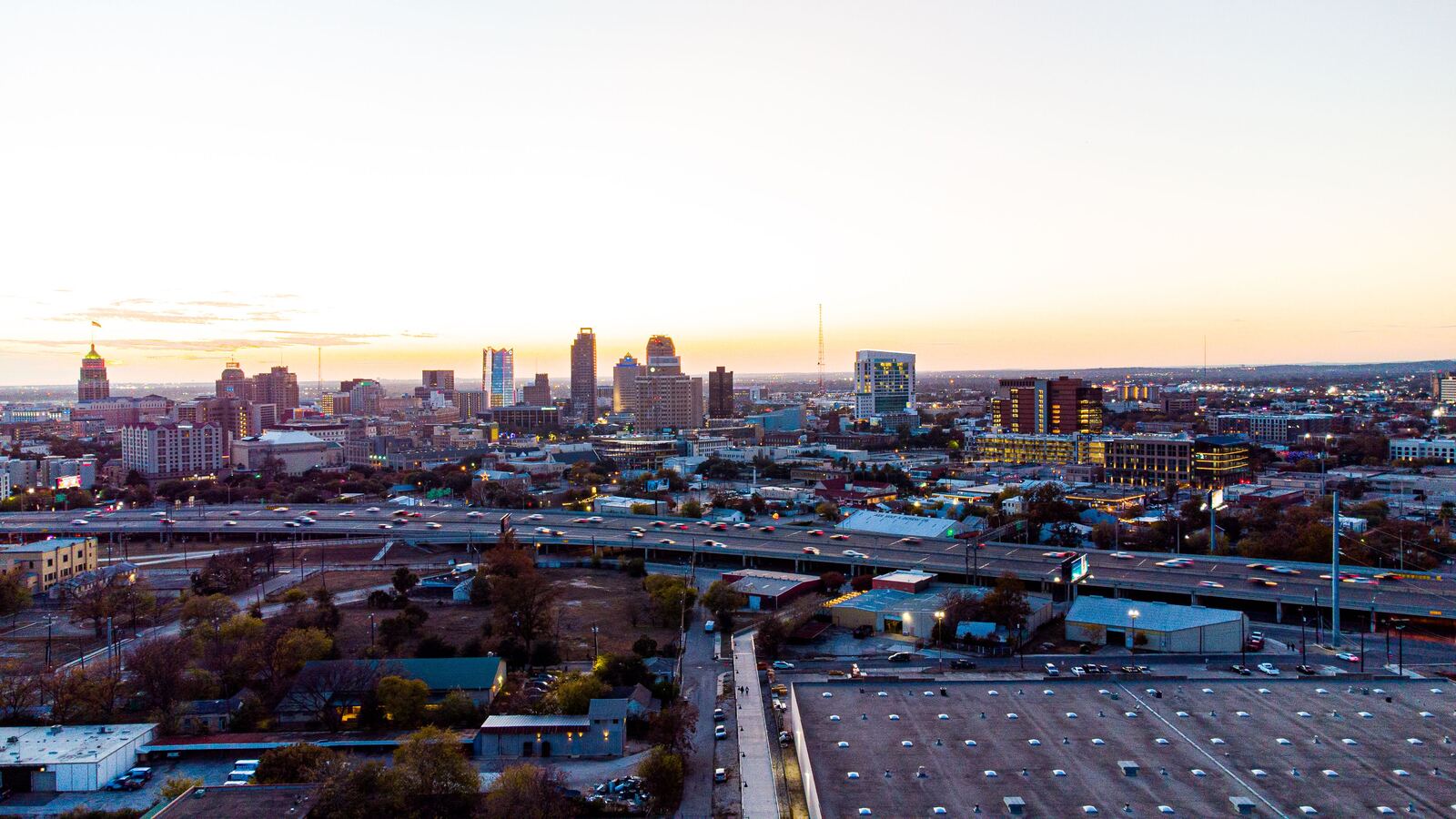 Aerial view of the San Antonio skyline and highways at dusk