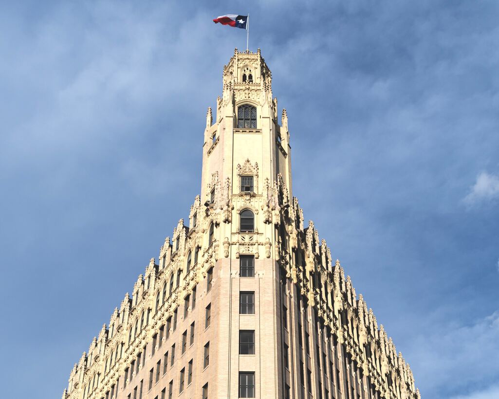 Historic Gothic tower flying the Texas flag in downtown San Antonio